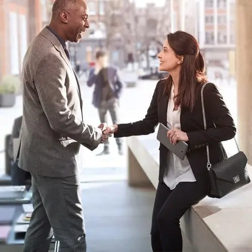 A man and a woman shaking hands.